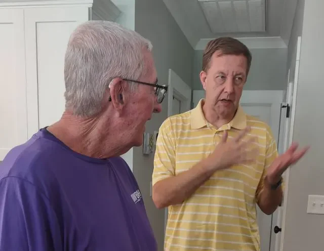 2 men talking together